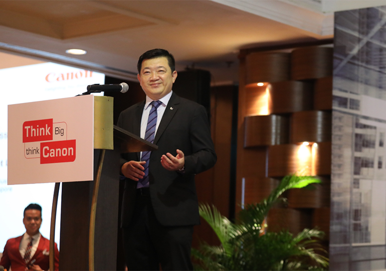 Mr. Vincent Low, Director & General Manager of Business Imaging Solutions in Canon, presenting his welcome address